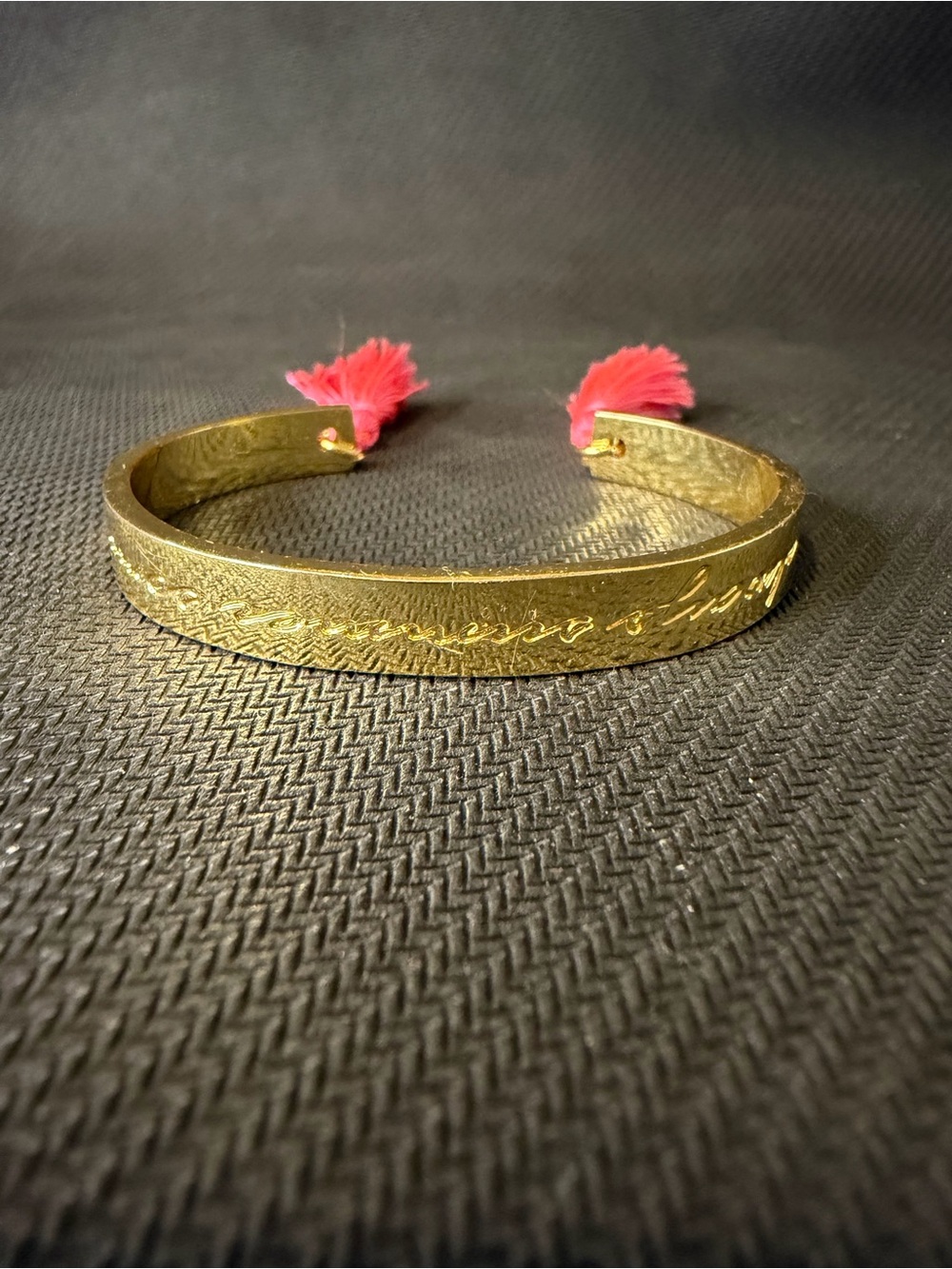 Golden Engraved Cuff Bracelet with Pink Tassels